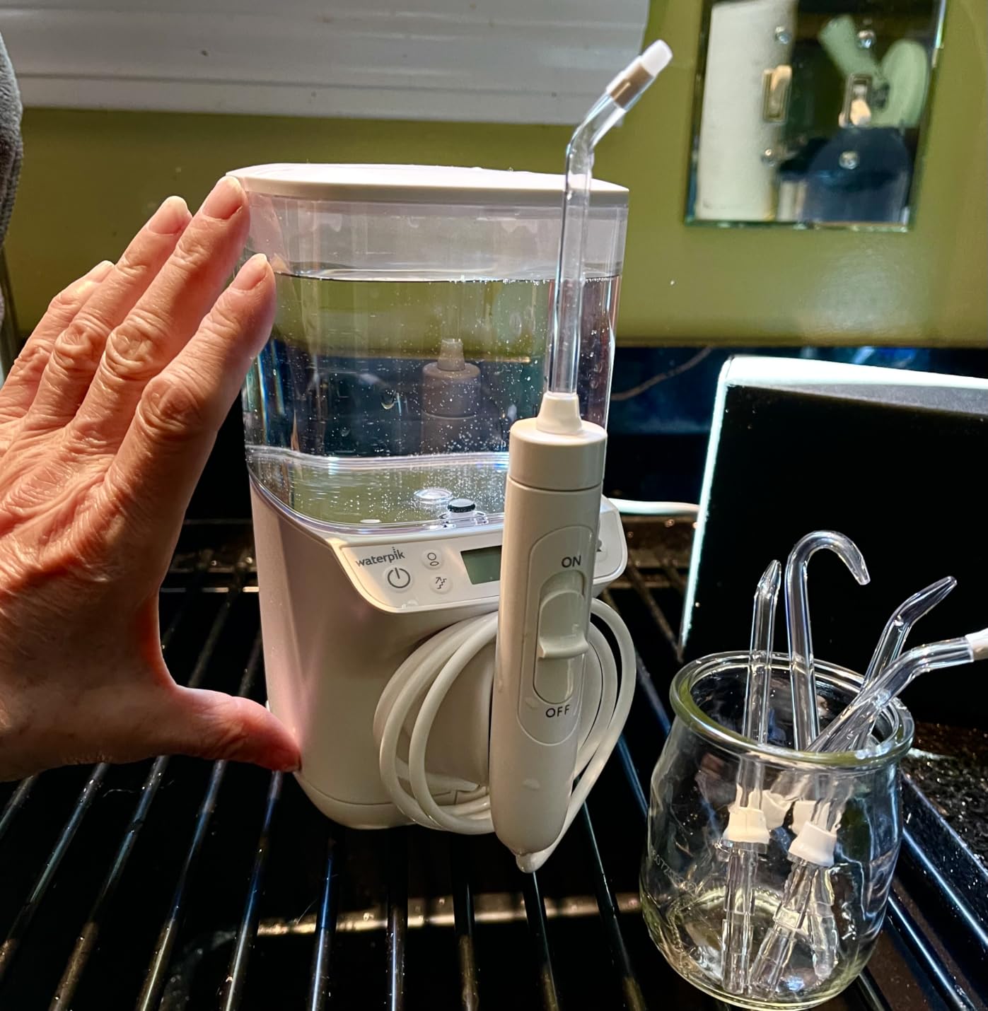 Waterpik Promax Water Flosser with SmartAdvance Mode for Daily Gum Health and Cleaning Teeth, Braces, Implants, ADA Accepted, Small Quiet Design, Electric Flosser with 10 Settings, 5 Tips, WF-23 customer photo 1